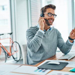 Shot of a young call centre agent working in an office